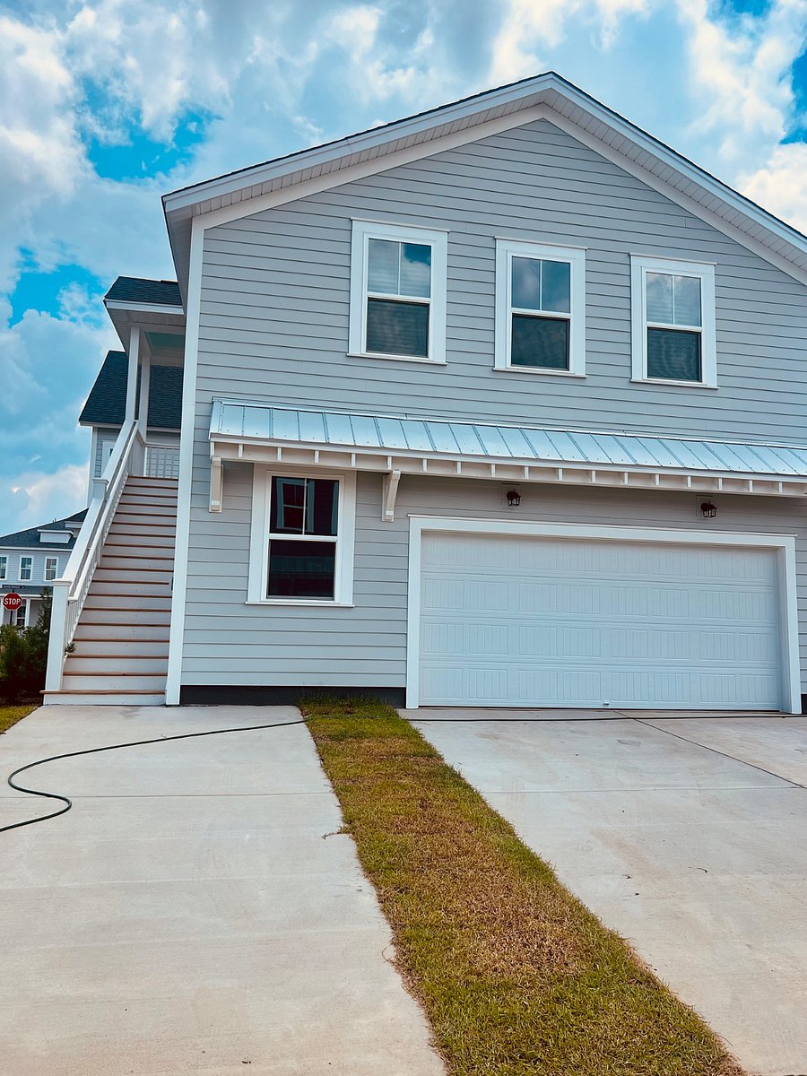 Exterior of the unit with designated parking space.