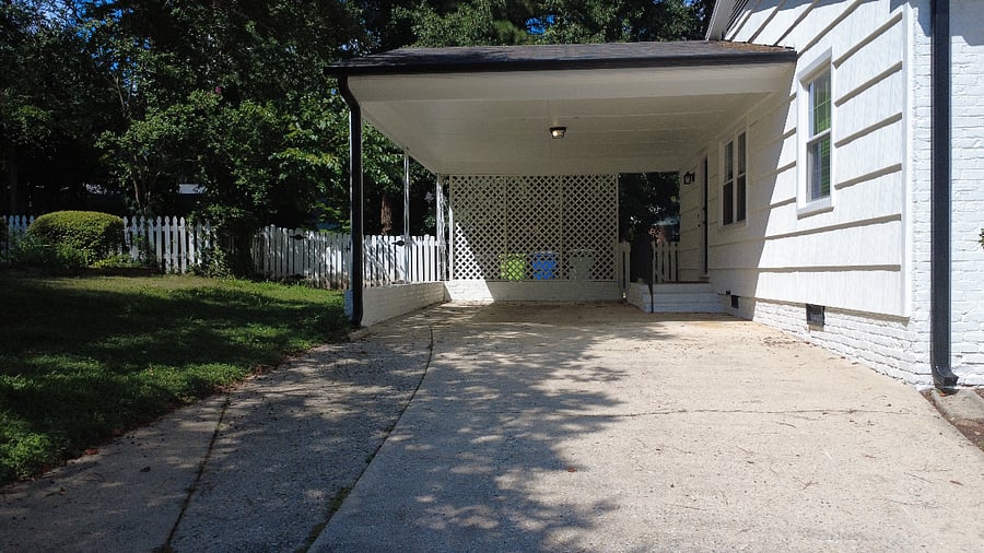 Carport and side entrance door into kitchen