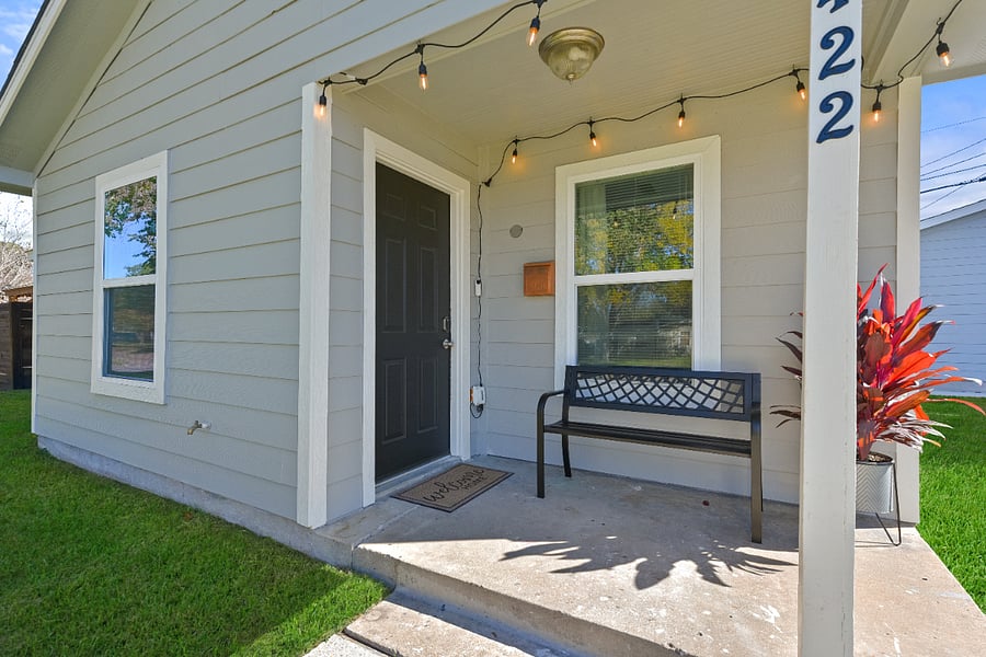 Front porch serenity: Where sunshine kisses the day, and our inviting bench whispers tales of relaxation. Take a seat, stay a while.  #PorchPerfection #WelcomeHome
