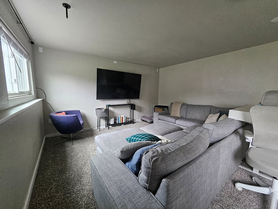 Downstairs living room with 75" TV