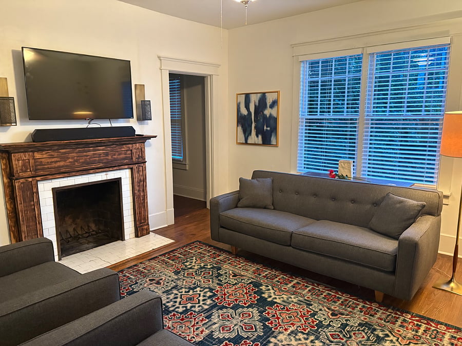 Living room with comfortable couch and smart TV.
