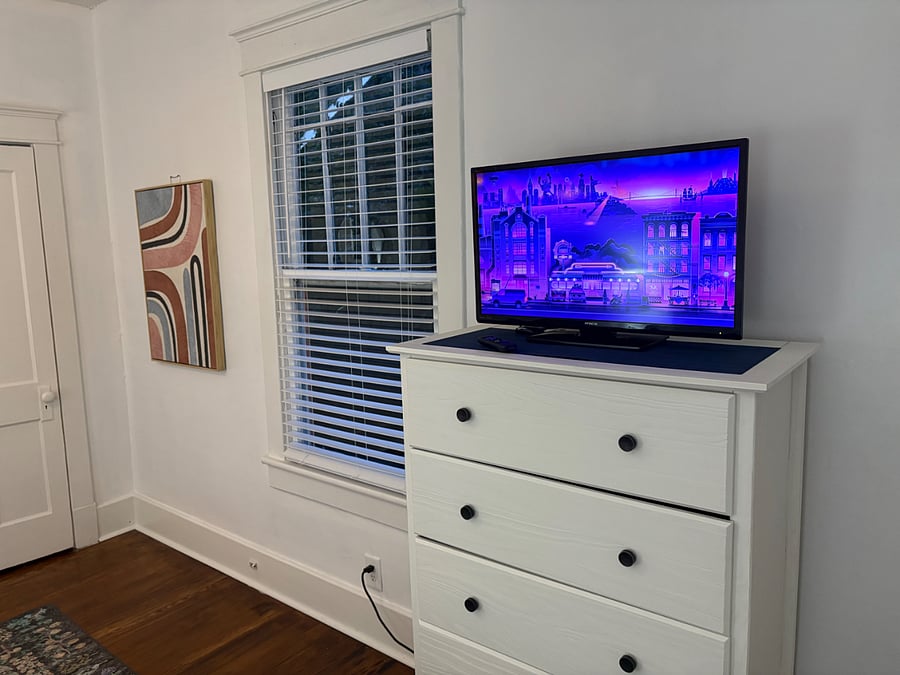 2nd bedroom with smart tv and closet. Fun art throughout !