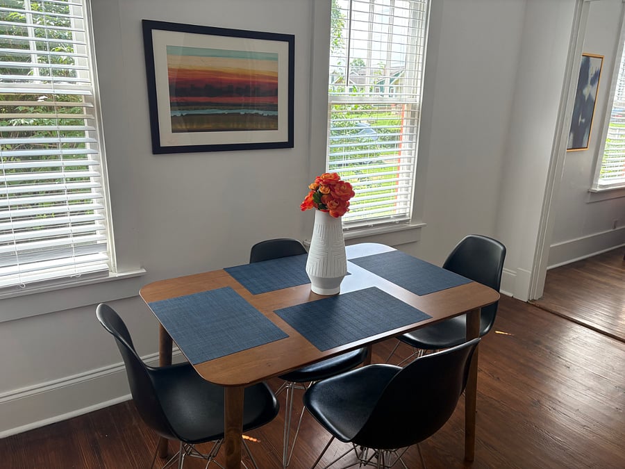 Dining room table located off living room across from desk (see previous picture). Use this art and vase as background for zoom calls!