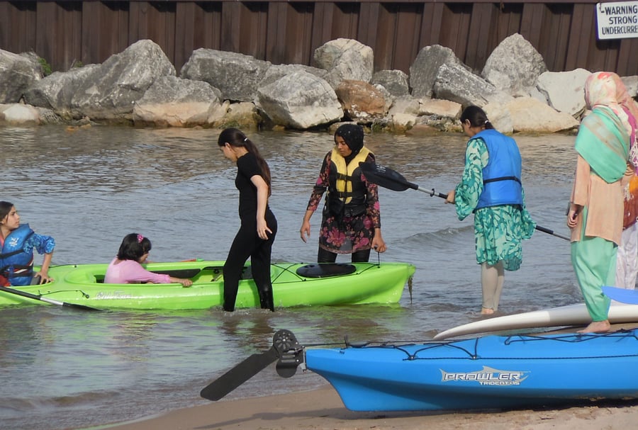 Launching Kayaks at the Dempster St Beach