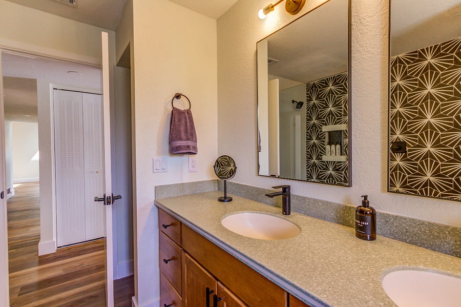 Bathroom with Dual Vanity Sinks and Walk-in Shower