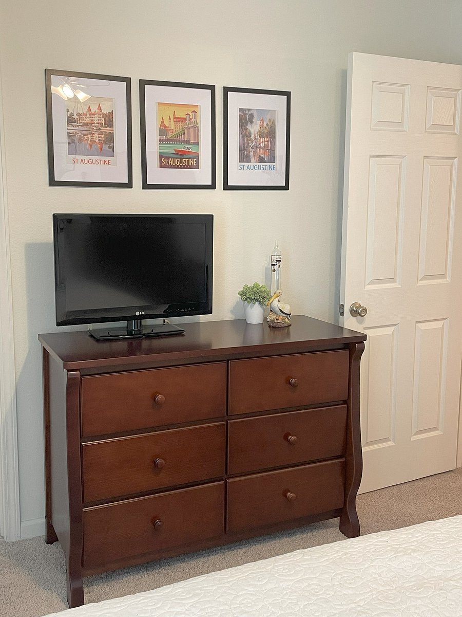 Your Bedroom includes dresser and TV located across from bed.