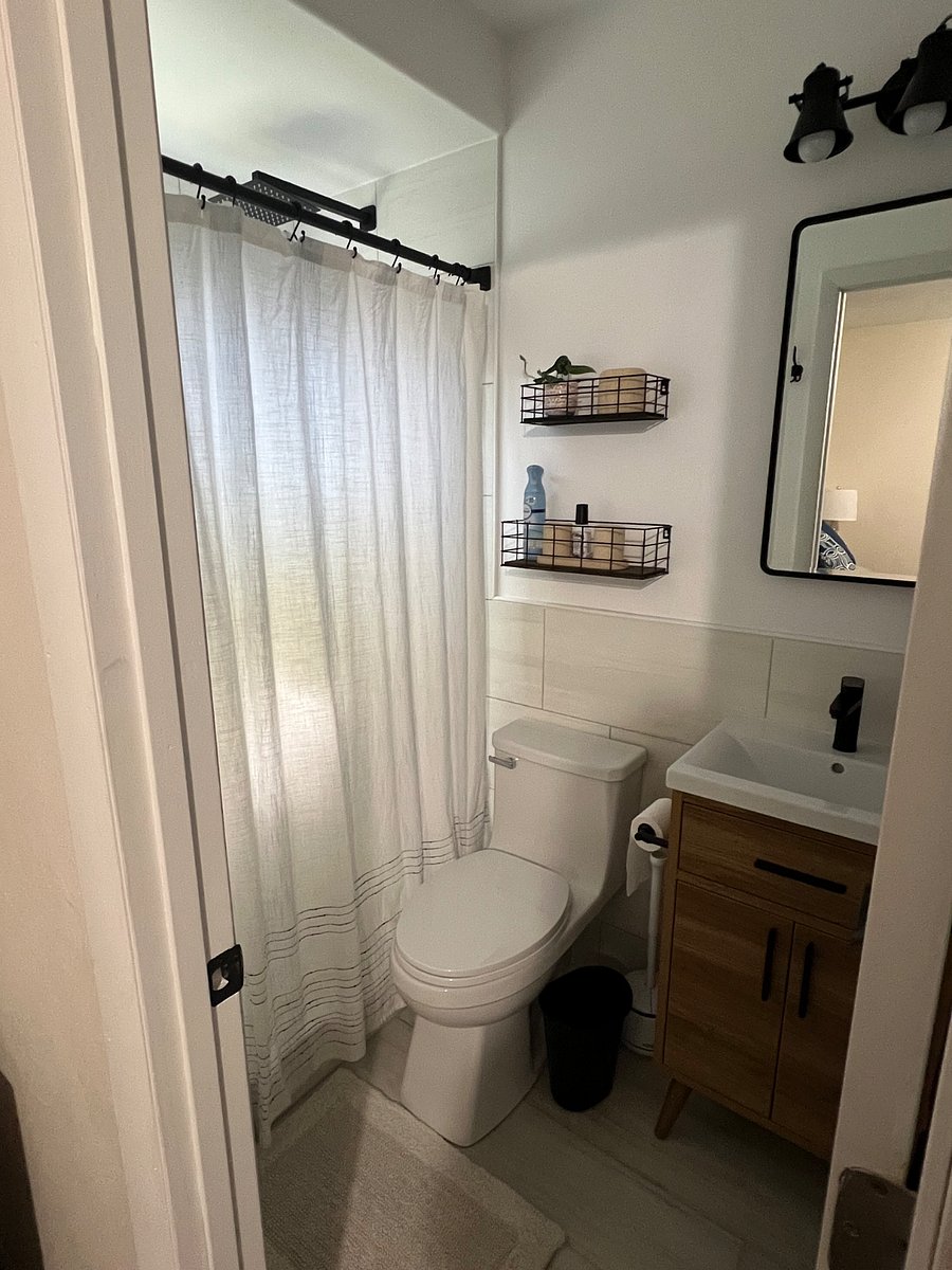 Newly renovated master bathroom. Blow dryer is in cabinet under sink.