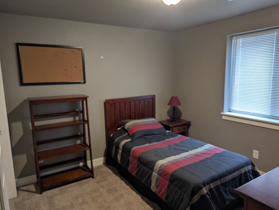 10x10 bedroom with bookshelf and twin bed