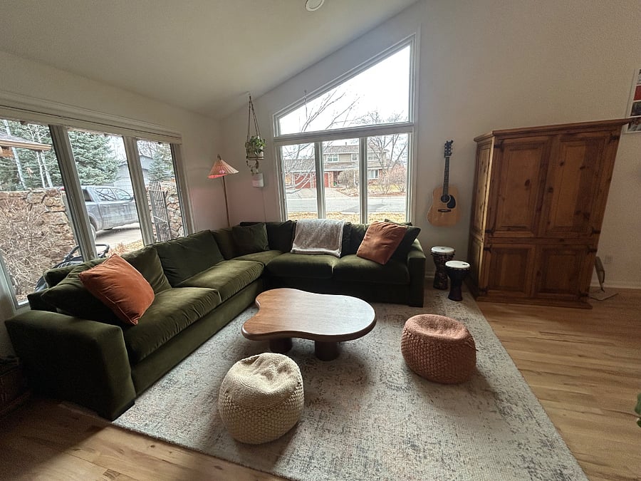Velvet green couch and sitting area