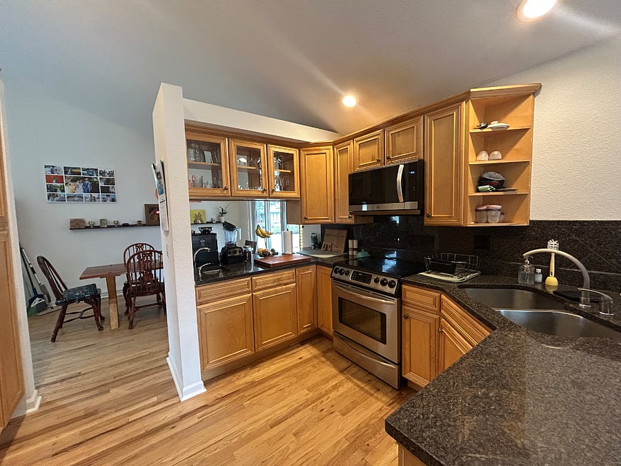 Kitchen with every appliance you could need including an espresso maker.