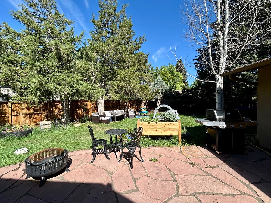 Huge backyard (on .3 acres of land). Mature trees, lots of shade, grill, firepit, electric sun awning, raised plant beds, mini pool (for summer), lots of flowers and plants. Multiple outdoor seating areas.