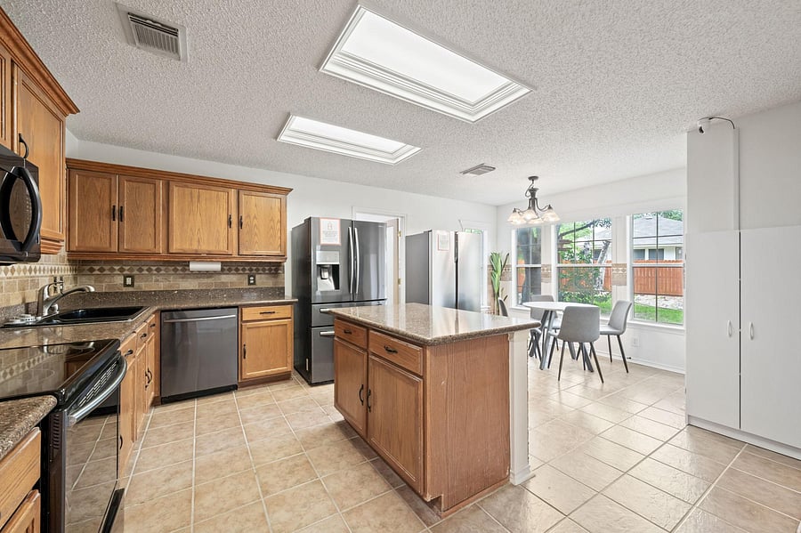 Large Kitchen with Multiple Refrigerators and Plenty of Storage