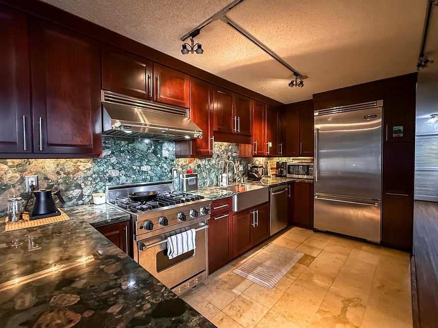 The kitchen is great and has a gas stove, convection oven, dishwasher, disposal, stainless steel appliances, stone countertops, and a reverse-osmosis water filter. The fridge was recently replaced.