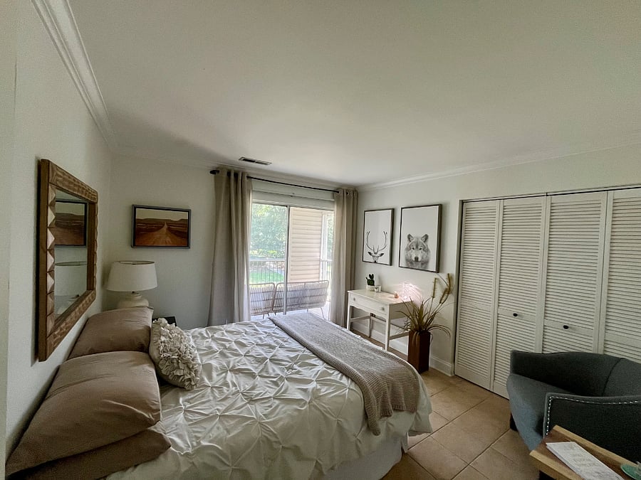 Bedroom #2: 
Queen bed. Sliding glass door opens up to outside patio that overlooks to the pool/clubhouse.
(shares bathroom with bedroom #1).