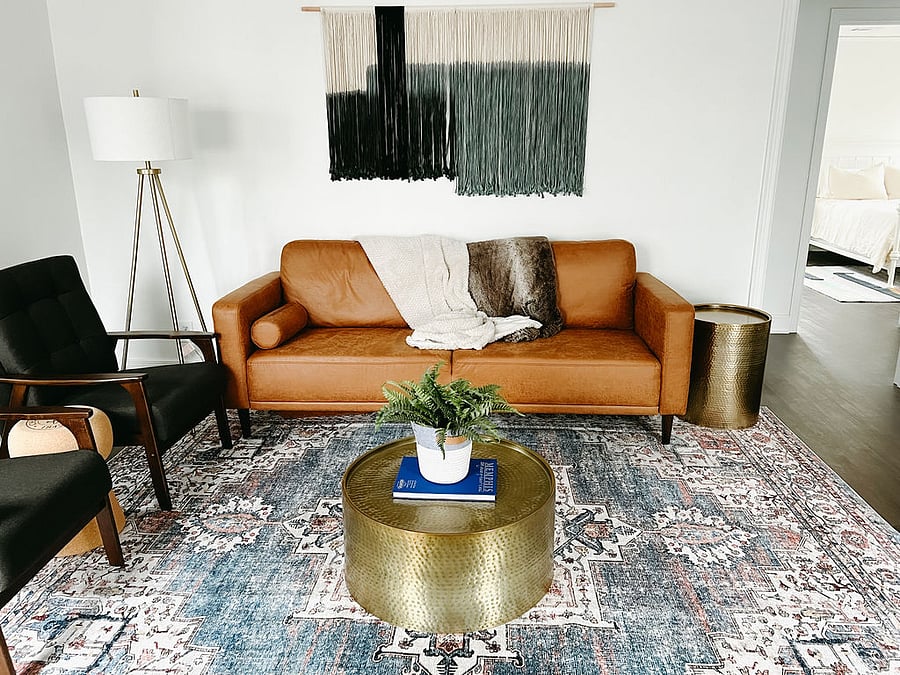 Relax in style in our cozy family room, where a plush couch awaits to cradle you after a day of exploring Memphis. Stream your favorite shows on the smart TV using our high-speed WiFi, or dive into the thoughtfully curated guidebook filled with Memphis attractions and event highlights. Decorative chairs add a touch of charm and ensure theres room for everyone to kick back.