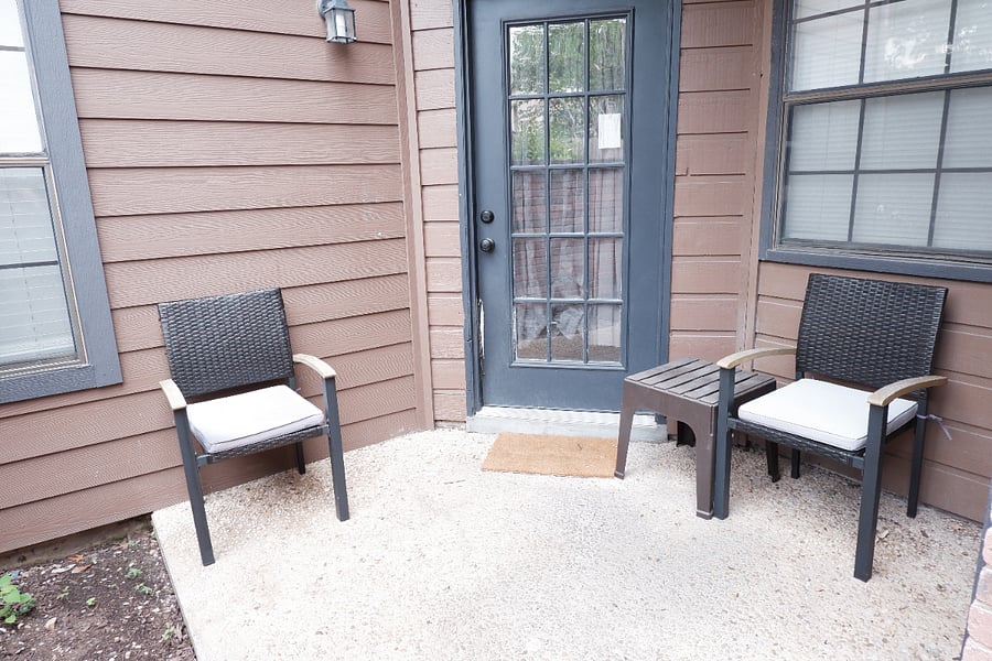 Cozy patio area with two chairs perfect for morning coffee or evening relaxation.