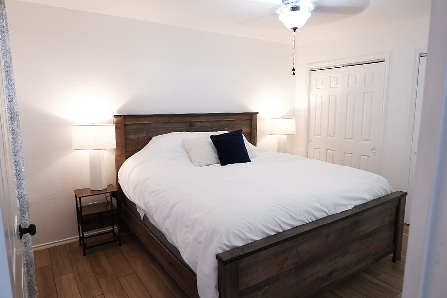 Spacious master bedroom featuring King bed, two closets and a private en-suite bathroom for added comfort and convenience.