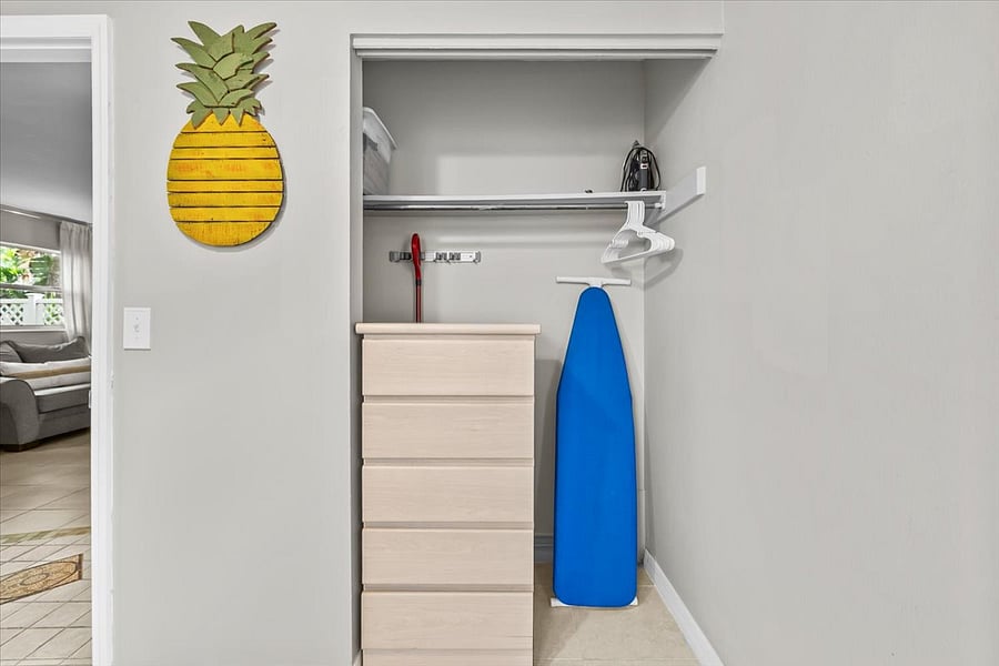 Full sized ironing board, large cleaning supplies, additional towels and bedding are found in the trundle bedroom closet