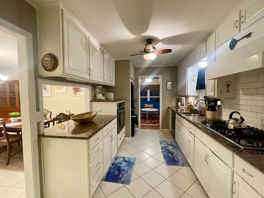 Kitchen adjacent to the game room, dining room and breakfast nook
