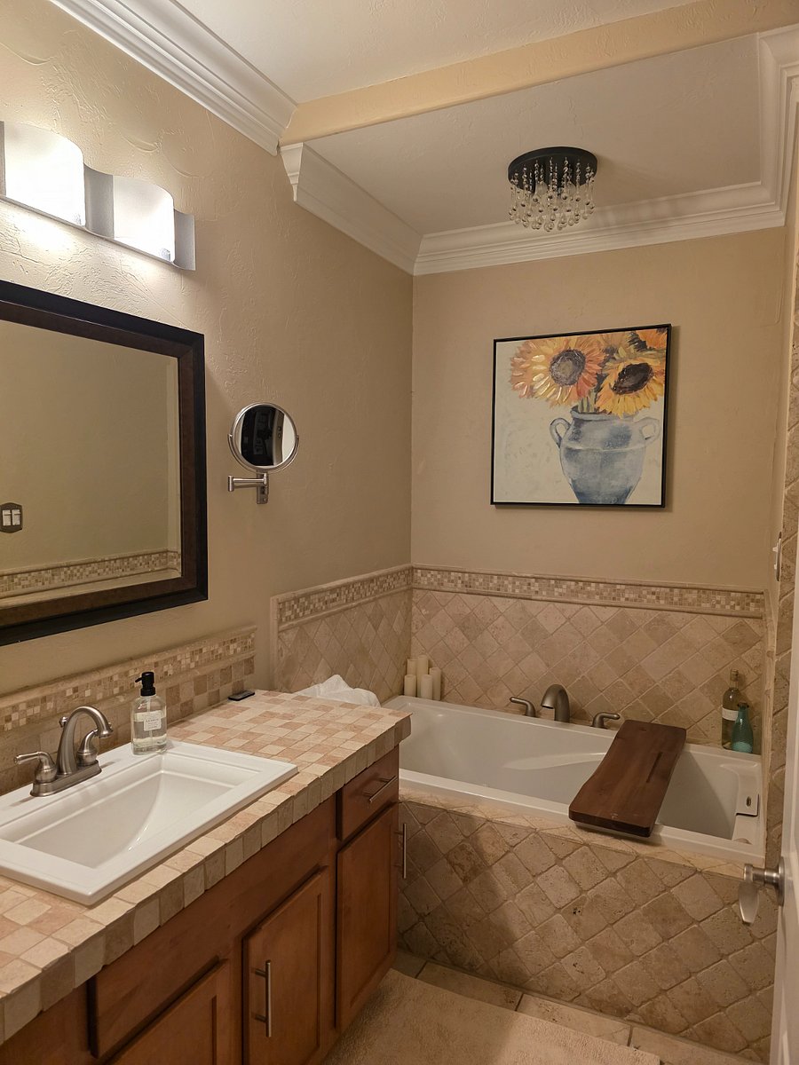 Jetted tub, travertine tile, double head shower, heated floors and space make this bathroom a delight to get ready for the day or unwind from the day.