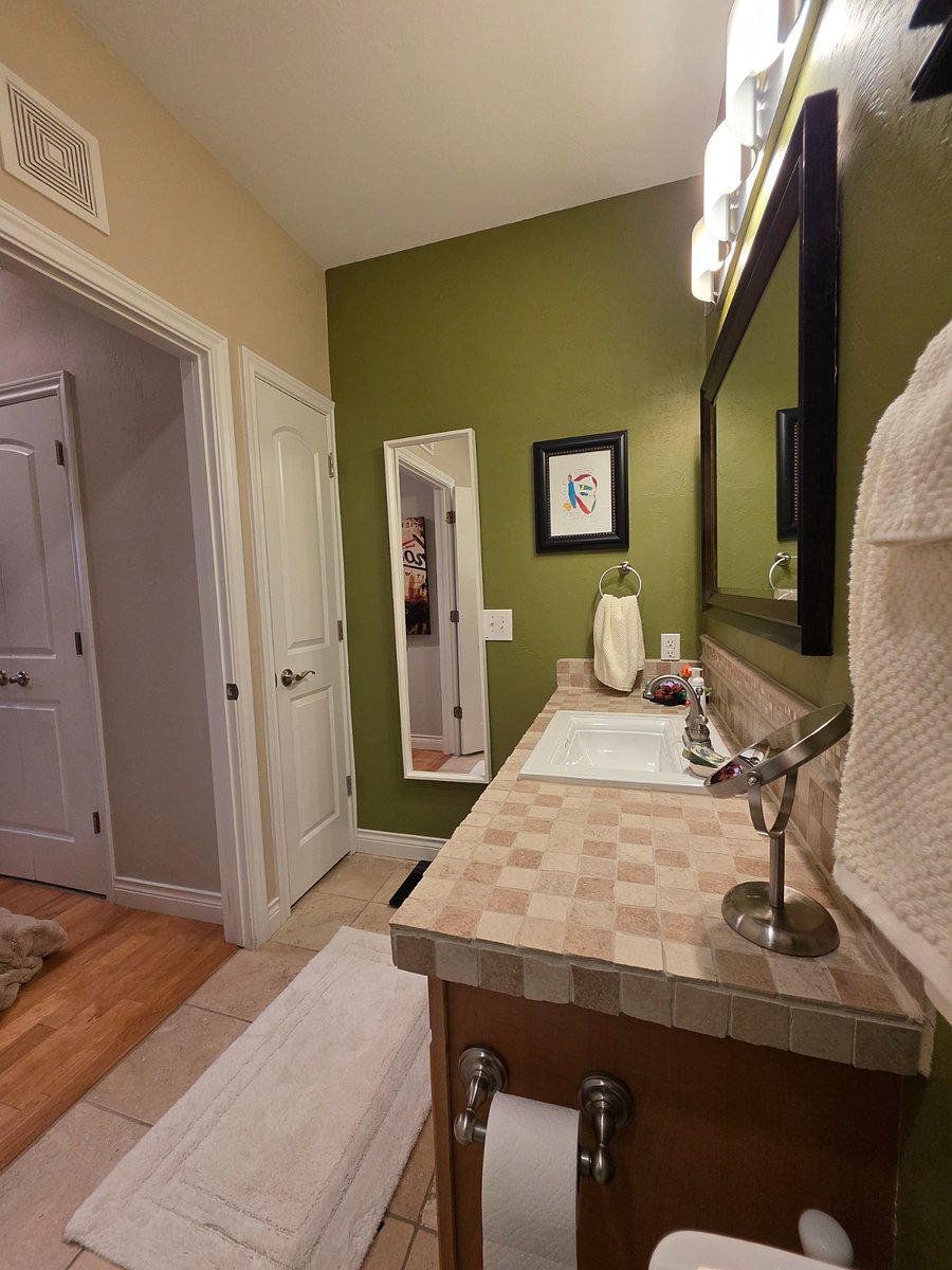 Second bath with a bathtub, linen closet and privacy.