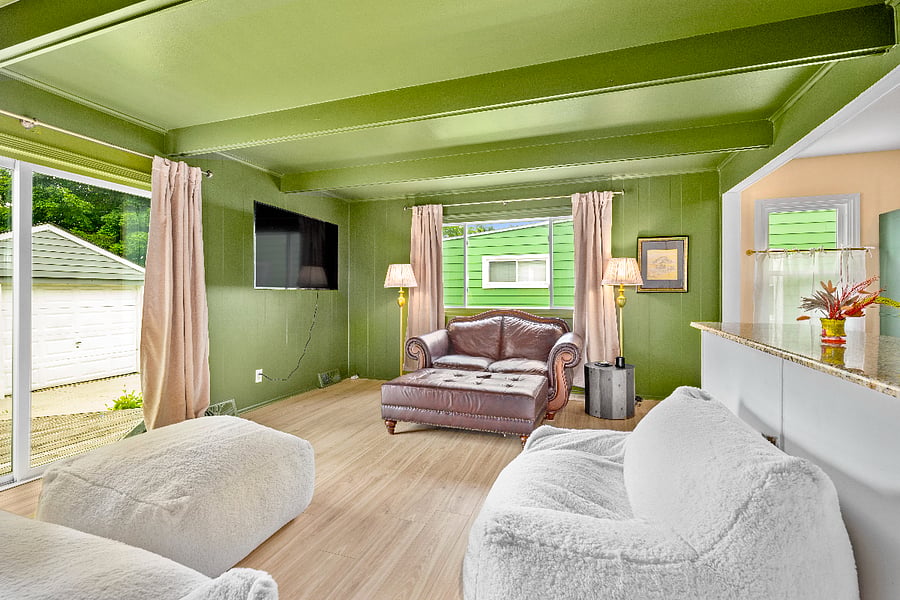 Living room leads to the backyard deck.