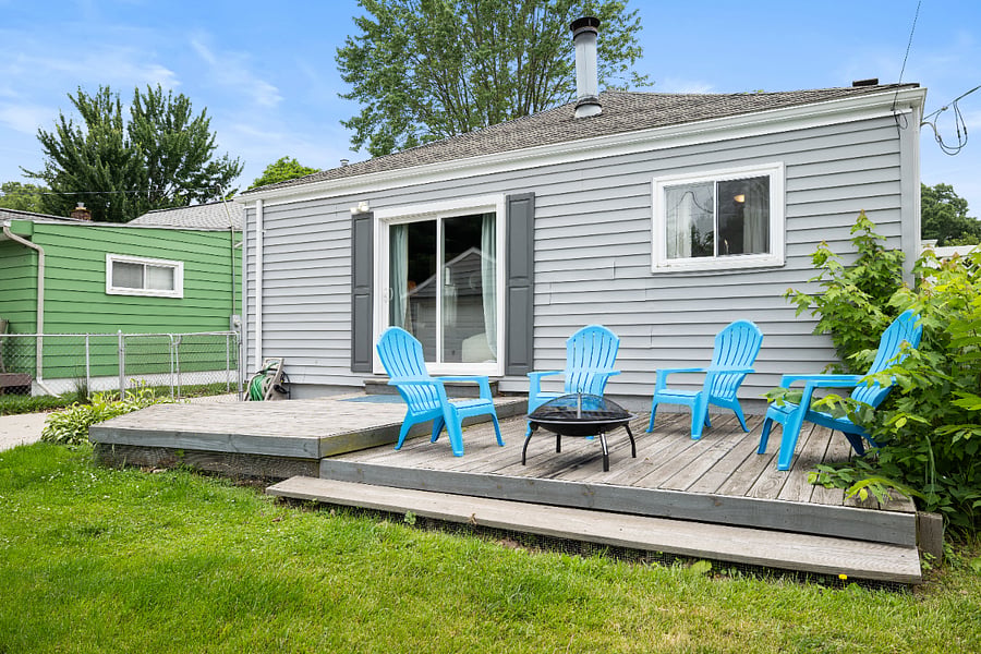 Enjoy Michigan under the stars. Five Adirondack chairs surround a fire pit. Firewood available on request.