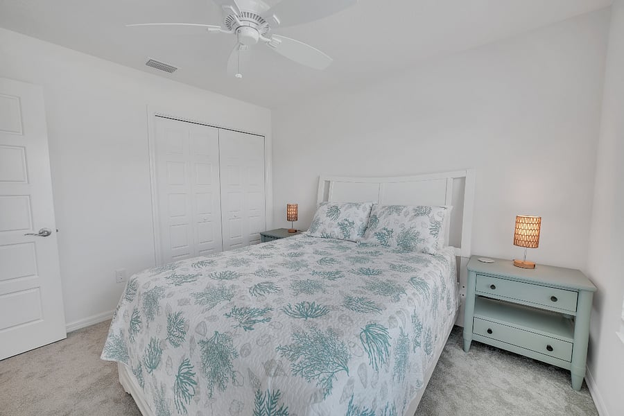View of queen bedroom with closet