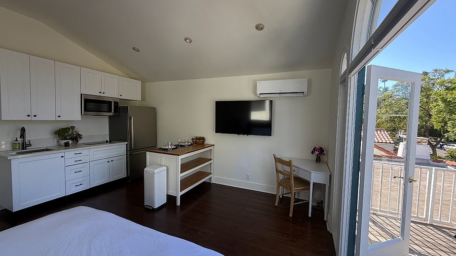 View from bed to kitchen & work area