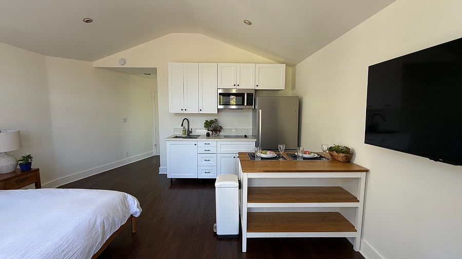 View of fully stocked kitchen with kitchen island