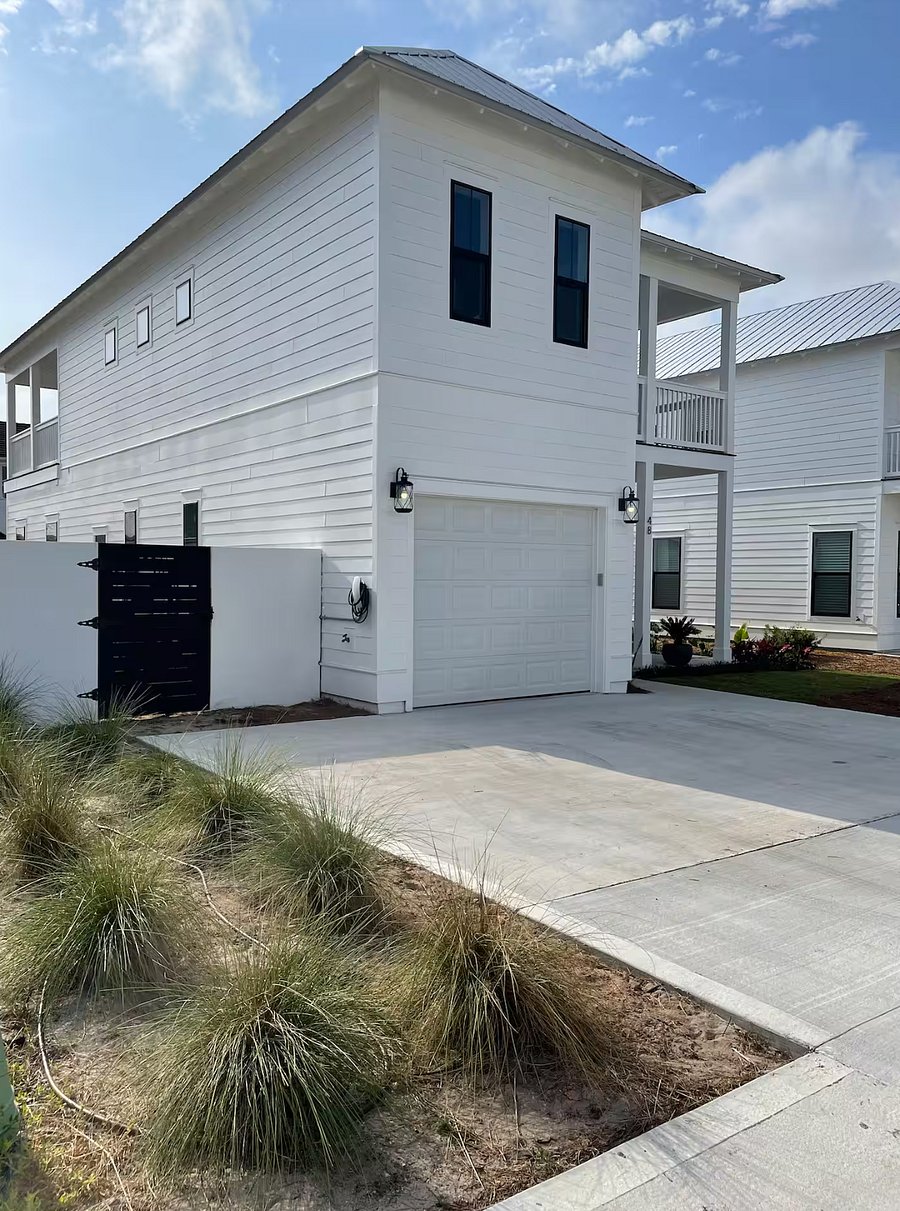 Driveway and backyard entrance. EV Charging.