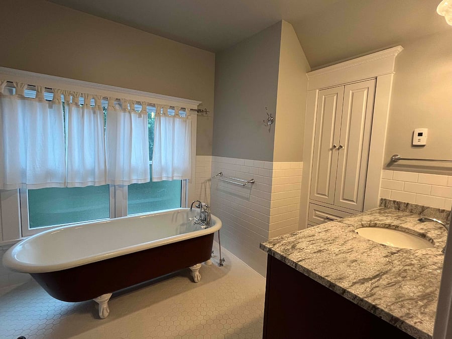 Attic (3rd floor) bathroom: Restored vintage claw foot soaking tub.