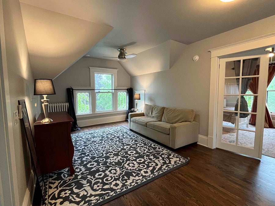 Attic (3rd floor) sitting room with queen-sized pull-out sofa. This room can be modified with floor-to-ceiling curtain dividers to make a 5th bedroom, if requested.