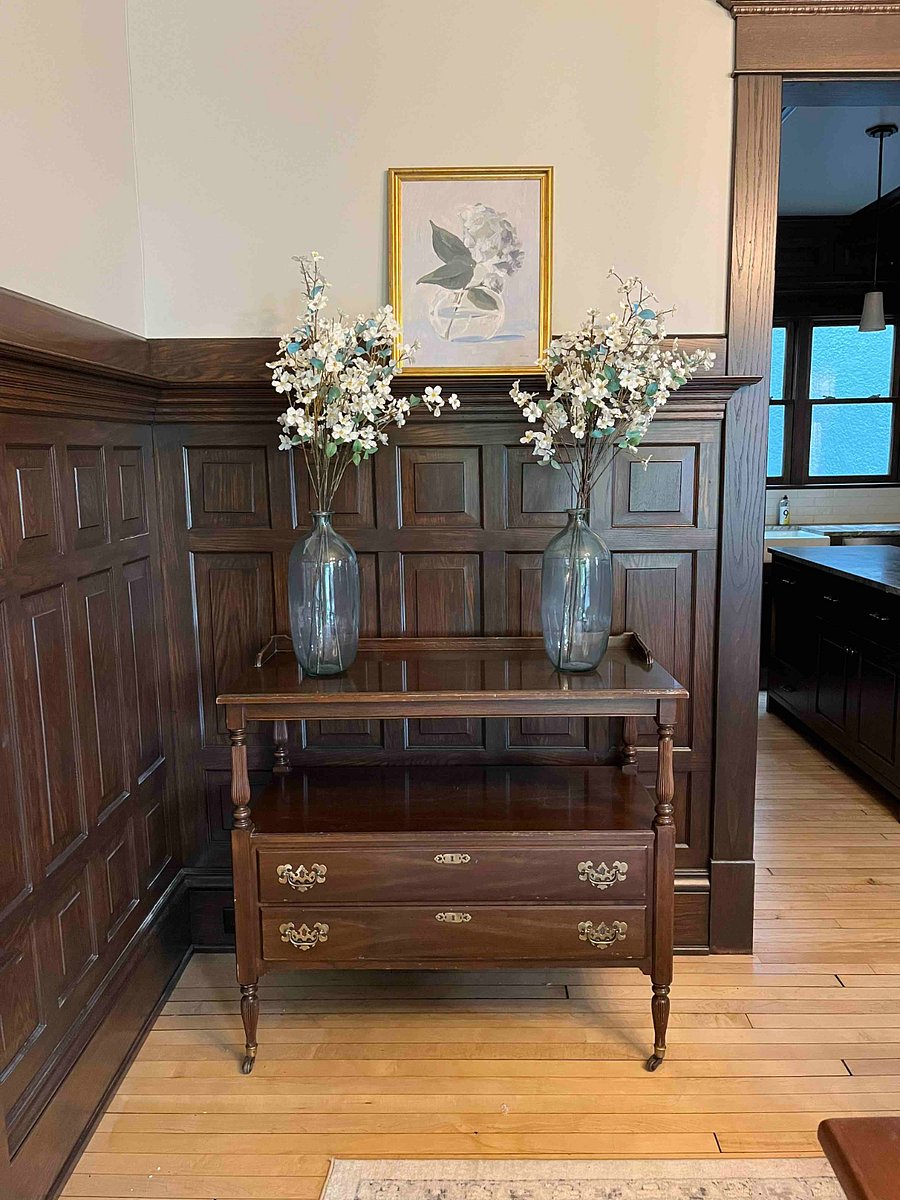 Original oak wainscoting in dining room has been restored.