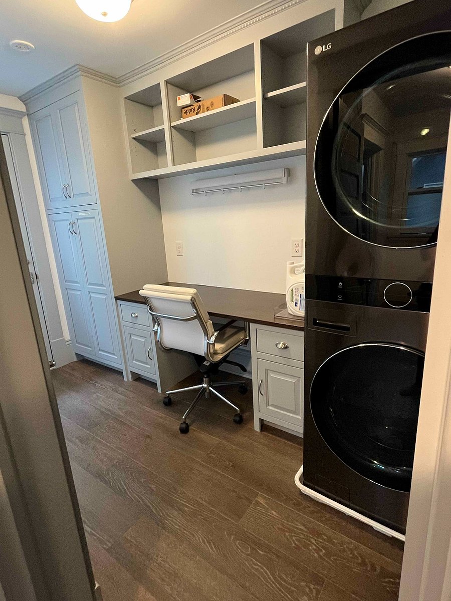 Washer and dryer located on second floor. The table can be used to either fold clothes, or as an extra desk. A hidden clothes drying rack is above the desk.