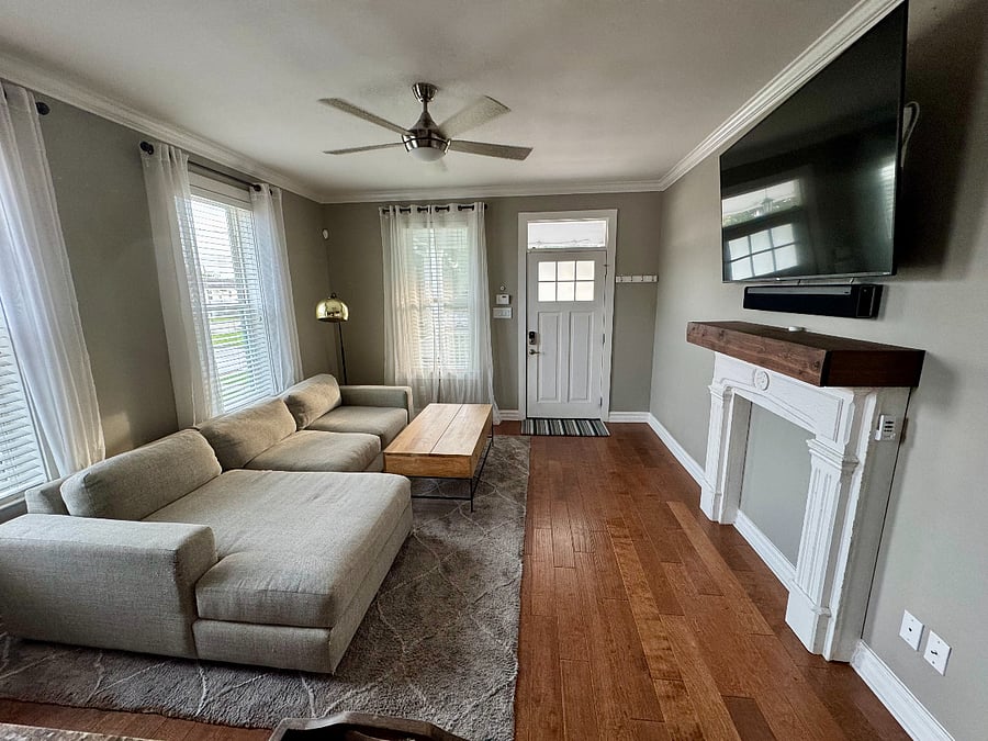 Living room. Deep sofa. Smart 65 TV with streaming apps. Sonos playbar.