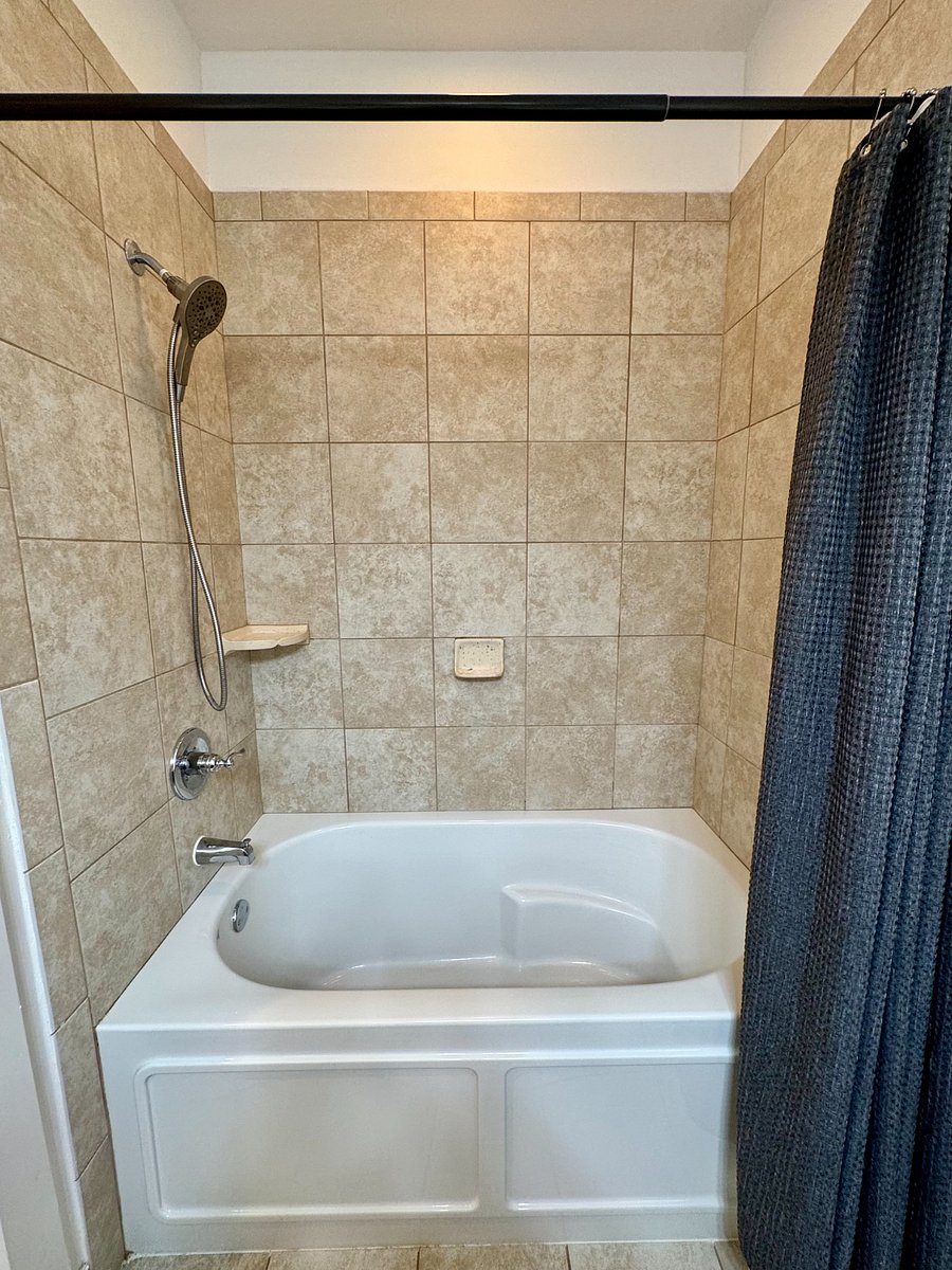 Master shower with soaking tub.