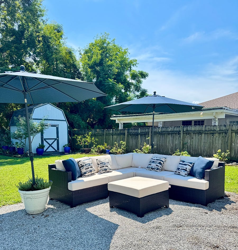 Outdoor seating with umbrellas for relaxing in the backyard.