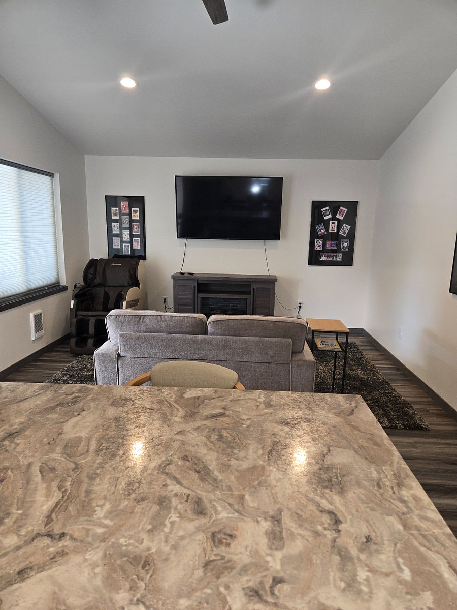 MASSAGE CHAIR, BIG SCREEN TV & FIREPLACE