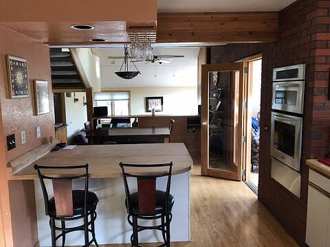 From kitchen looking into dining room and living room