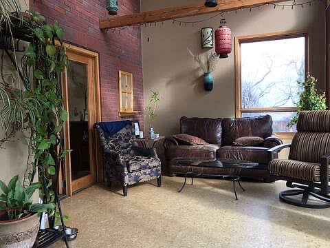 Sunroom with access to back deck and yard