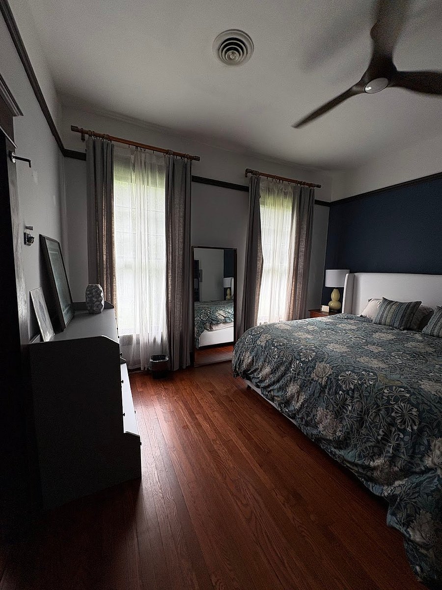Bedroom with king sized bed, dresser and spacious closet