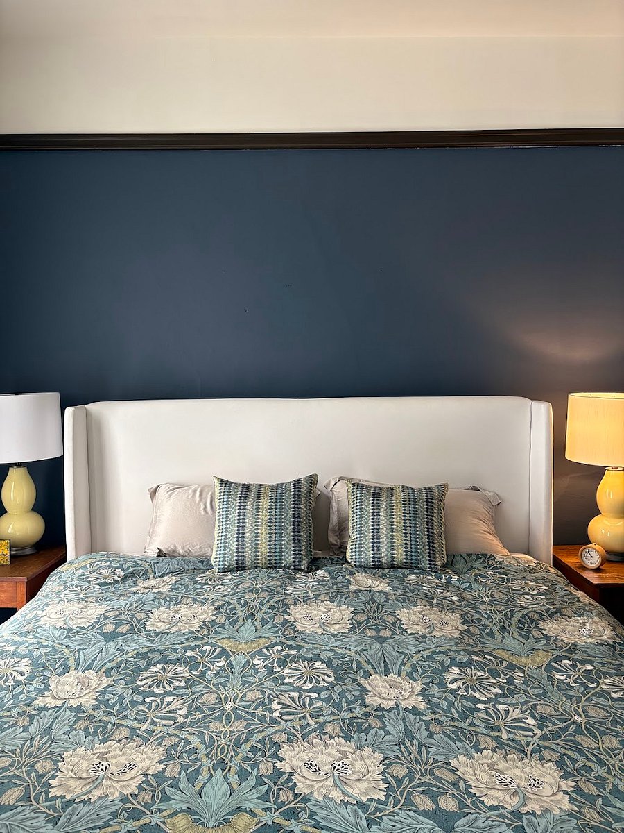 Bedroom with king sized bed, dresser and spacious closet