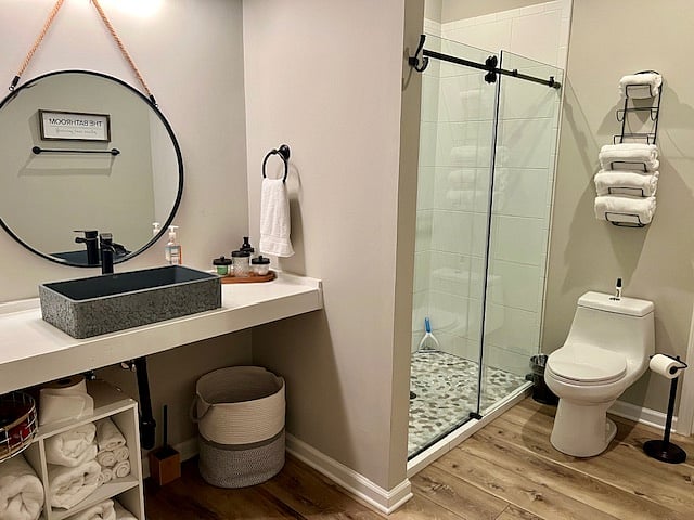 Spacious Bathroom w/ tiled shower and barn shower door.