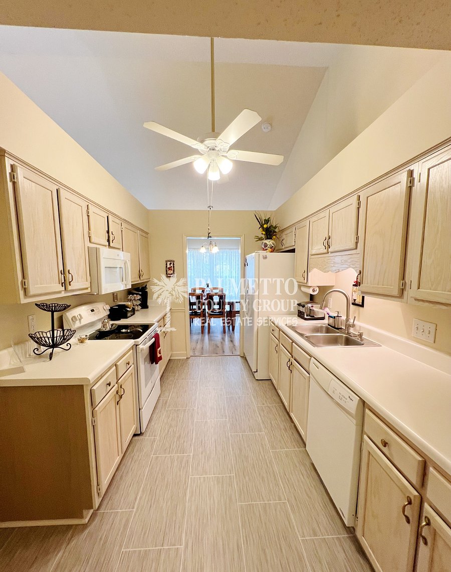 Kitchen with all appliances, cutlery, dishware, pots and pans.
