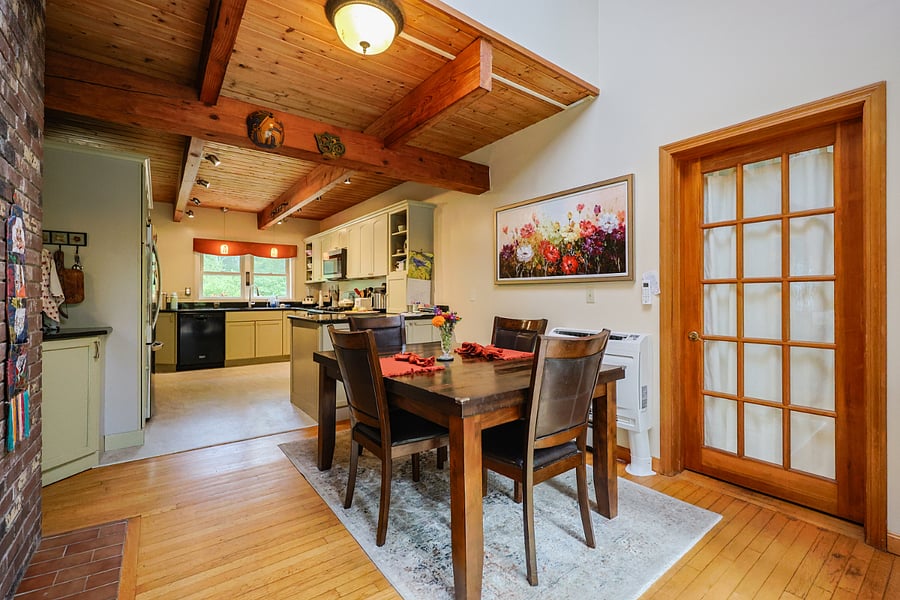 Dining area leads into kitchen. Door to owners section of house