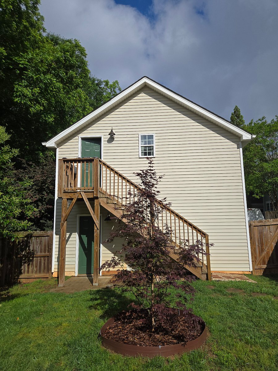 The studio is above the 2 car garage at the rear of the lot, which is fenced in. Parking will be provided in the garage, as well as some storage shelving