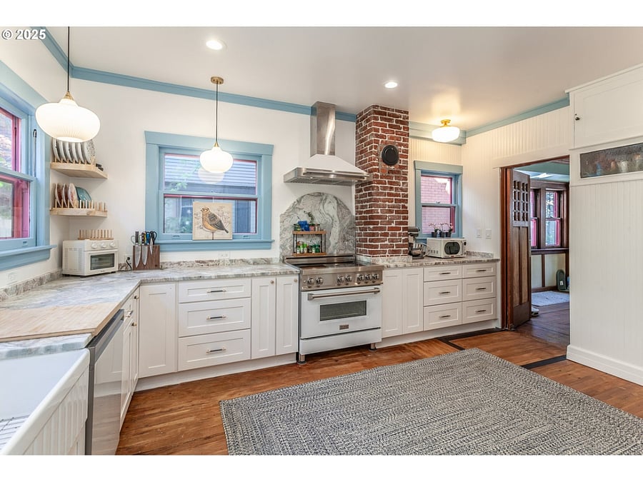 Kitchen with 6 burner gas stove with electric convection oven