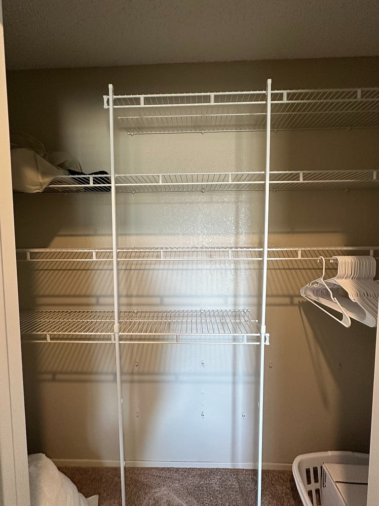 Bedroom 2 Closet with shelving system.