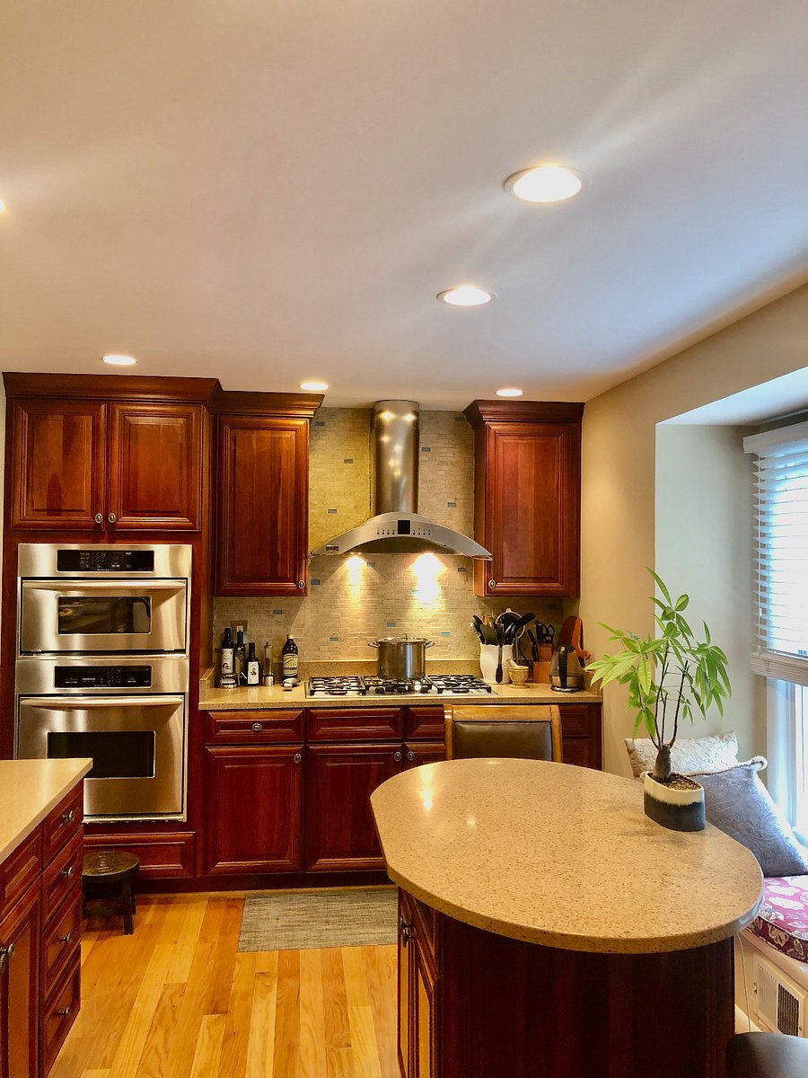 Gas Stove with Stainless Steel Hood and Quartz Countertops